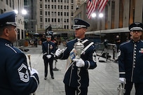 U.S. Air Force Chief Master Sgt. Daniel Valadie, drum major, talks with his fellow members of The United States Air Force Band’s Ceremonial Brass before recording for a live TODAY Show broadcast in New York City on July 2, 2021. The official ceremonial ensemble comprises 41 active-duty Airmen who provide musical support for funerals at Arlington National Cemetery, arrivals for foreign heads of state at the White House and Pentagon, patriotic programs, changes of command, retirements, and awards ceremonies. (U.S. Air Force photo by Staff Sgt. Kayla White)