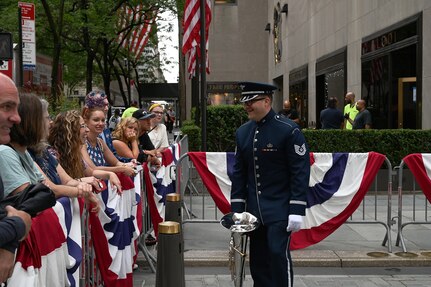 U.S. Air Force Tech. Sgt. Chris McGinty, a euphonium player assigned to The United States Air Force Band’s Ceremonial Brass, talks to TODAY Show audience members before recording for a live broadcast in New York City on July 2, 2021. The official ceremonial ensemble comprises 41 active-duty Airmen who provide musical support for funerals at Arlington National Cemetery, arrivals for foreign heads of state at the White House and Pentagon, patriotic programs, changes of command, retirements, and awards ceremonies. (U.S. Air Force photo by Staff Sgt. Kayla White)