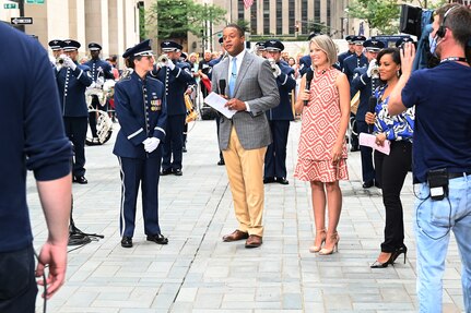 U.S. Air Force Capt. Christina Muncey, premier band flight commander and associate conductor with The United States Air Force Band, talks to TODAY Show hosts during a live interview on the TODAY Show in New York City July 2, 2021. The official ceremonial ensemble comprises 41 active-duty Airmen who provide musical support for funerals at Arlington National Cemetery, arrivals for foreign heads of state at the White House and Pentagon, patriotic programs, changes of command, retirements, and awards ceremonies. (U.S. Air Force photo by Staff Sgt. Kayla White)