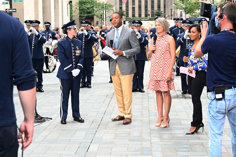 U.S. Air Force Capt. Christina Muncey, premier band flight commander and associate conductor with The United States Air Force Band, talks to TODAY Show hosts during a live interview on the TODAY Show in New York City July 2, 2021. The official ceremonial ensemble comprises 41 active-duty Airmen who provide musical support for funerals at Arlington National Cemetery, arrivals for foreign heads of state at the White House and Pentagon, patriotic programs, changes of command, retirements, and awards ceremonies. (U.S. Air Force photo by Staff Sgt. Kayla White)