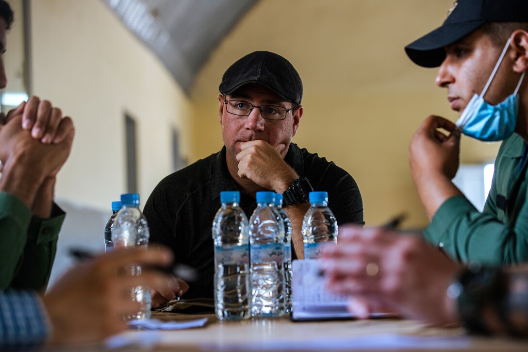 U.S. Army Soldiers, assigned to 404th Civil Affairs Battalion and the Moroccan Gendarmeire, conduct a mass-screening event in Tifnit, Morocco, on June 13, 2021. African Lion 2021 is U.S. Africa Command's largest, premier, joint, annual exercise hosted by Morocco, Tunisia, and Senegal, 7-18 June. More than 7,000 participants from nine nations and NATO train together with a focus on enhancing readiness for U.S. and partner nation forces. African Lion 21 is a multi-domain, multi-component, and multinational exercise, which employs a full array of mission capabilities with the goal to strengthen interoperability among participants.