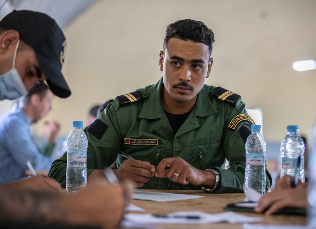 U.S. Army Soldiers, assigned to 404th Civil Affairs Battalion and the Moroccan Gendarmerie, conduct a mass-screening event in Tifnit, Morocco, on June 13, 2021. Africa Lion 2021 is U.S. Africa Command’s largest, premier, joint, annual exercise hosted by Morocco, Tunisia, and Senegal, 7-18 June. More than 7,000 participants from nine nations and NATO train together with a focus on enhancing readiness for U.S. and partner nation forces. Africa Lion 21 is a multi-domain, multi-component, and multinational exercise, which employs a full array of mission and capabilities with the goal to strengthen interoperability among participants.