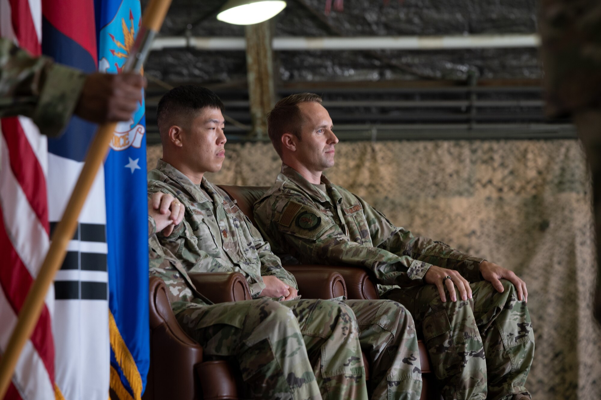 Maj. Hoyoon Chung, 51st Munitions Squadron outgoing commander, left, and Maj Scott Kubalek, 51st MUNS inbound commander, listen to an invocation during the 51st MUNS change of command at Osan Air Base, Republic of Korea, July 6, 2021. The change of command ceremony is deeply rooted in military tradition that dates back to the reign of King Frederick of Prussia and has persisted into modern day. (U.S. Air Force photo by Tech. Sgt. Nicholas Alder)