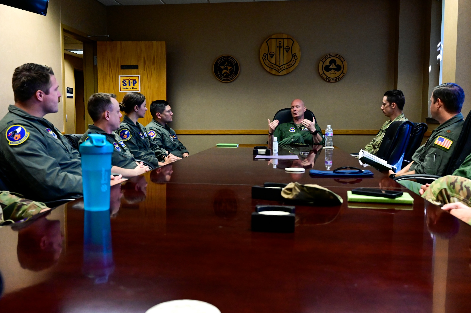 Col. Thomas Lankford, 314th Operations Group commander, speaks in a meeting with first assignment instructor pilots