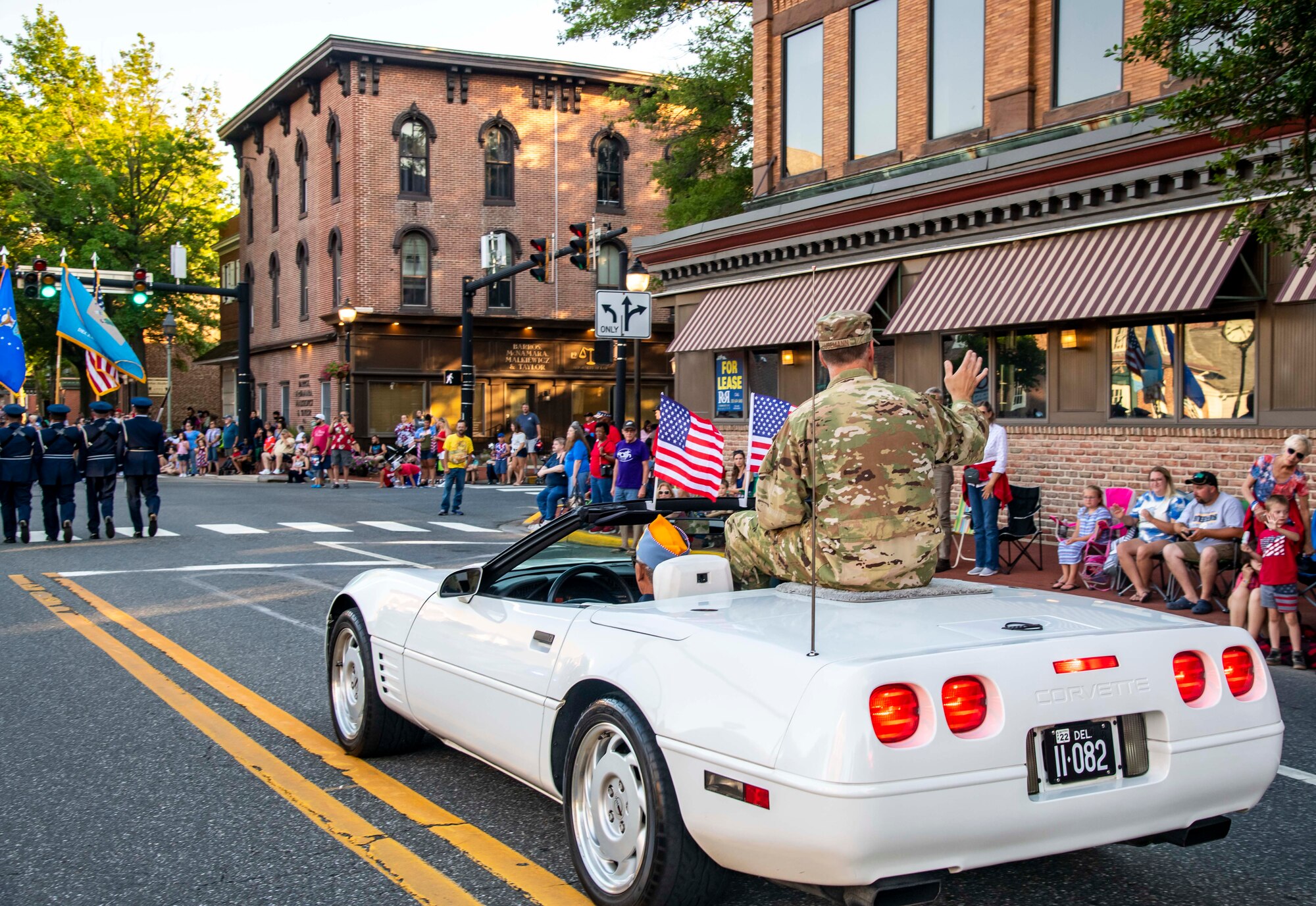 Col. Matt Husemann, 436th Airlift Wing commander, waves to the crowd during the annual Fourth of July Celebration parade in Dover, Delaware, July 4, 2021. Husemann served as grand marshal for the event, which also included participation by the base honor guard and fire department. (U.S. Air Force photo by Senior Airman Stephani Barge)