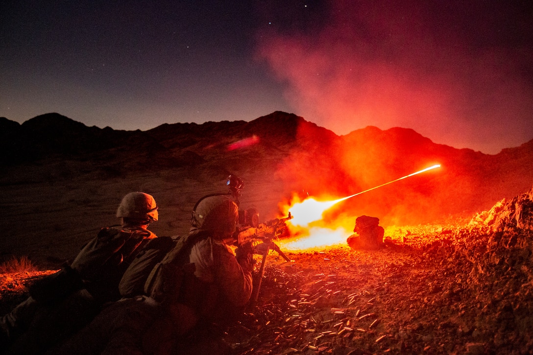 CAMP TITIN, Jordan (June 21, 2021) Marines assigned to the 24th Marine Expeditionary Unit (MEU) provide support-by-fire with an M240B medium machine gun while conducting night live-fire platoon assault training during a theater amphibious combat rehearsal (TACR) in Camp Titin, Jordan, June 21, 2021. TACR integrates U.S. Navy and Marine Corps assets to exercise a range of critical combat-related capabilities, both afloat and ashore. 24th MEU is deployed to the U.S. 5th Fleet area of operations in support of naval operations to ensure maritime stability and security in the central region, connecting the Mediterranean and Pacific through the western Indian Ocean and three strategic choke points. (U.S. Marine Corps photo by 1st Lt. Mark Andries)