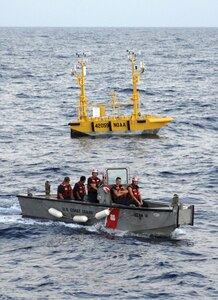 People float in a small boat.