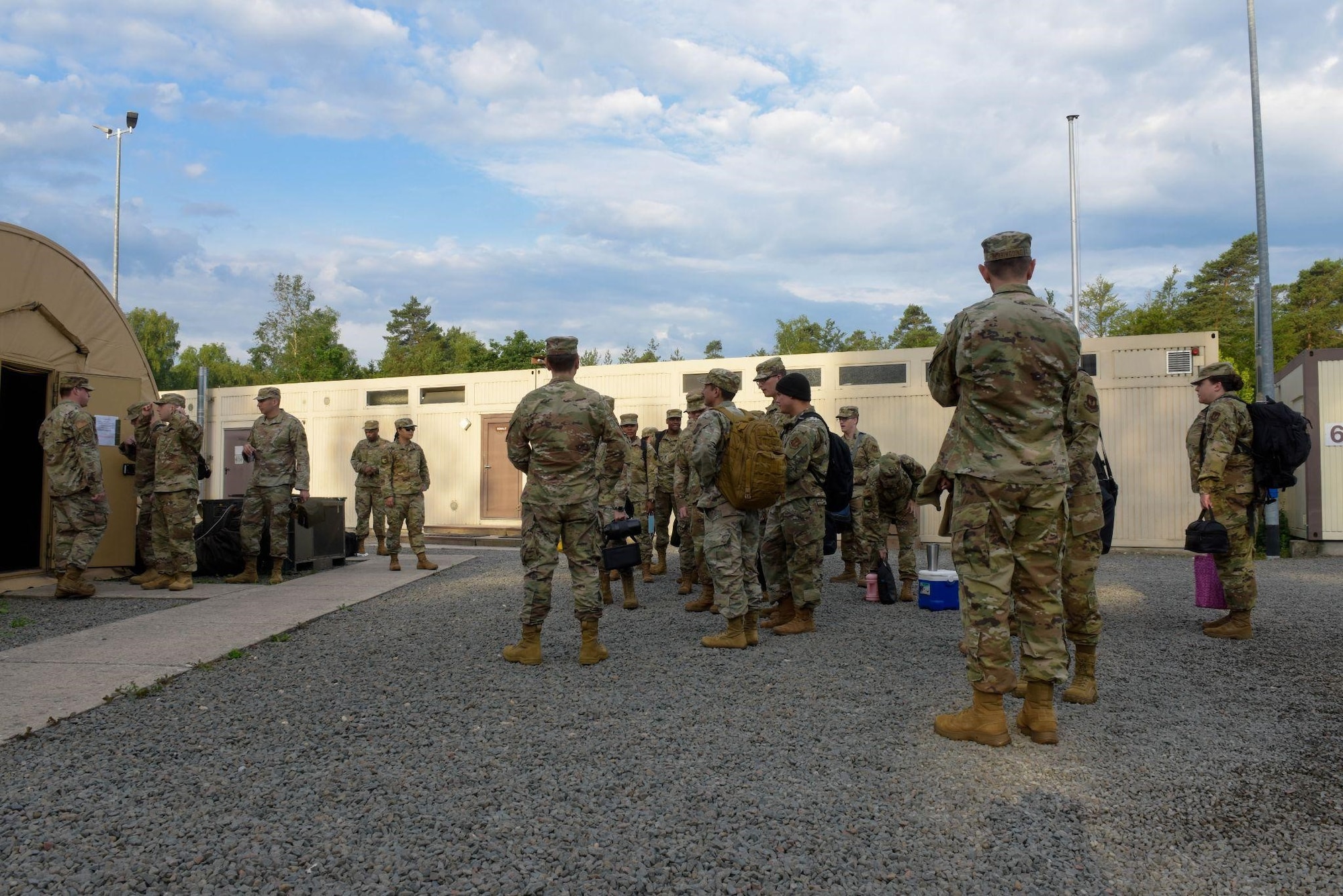 U.S. Air Force Airmen from the 700th Contracting Squadron, 764th Enterprise Sourcing Squadron and 52nd CONS wait for a contracting training exercise to begin on Ramstein Air Base, Germany, June 28, 2021. The exercise takes place annually to give Airmen an opportunity to train in a simulated deployed environment. (U.S. Air Force photo by Airman 1st Class Madelyn Keech)