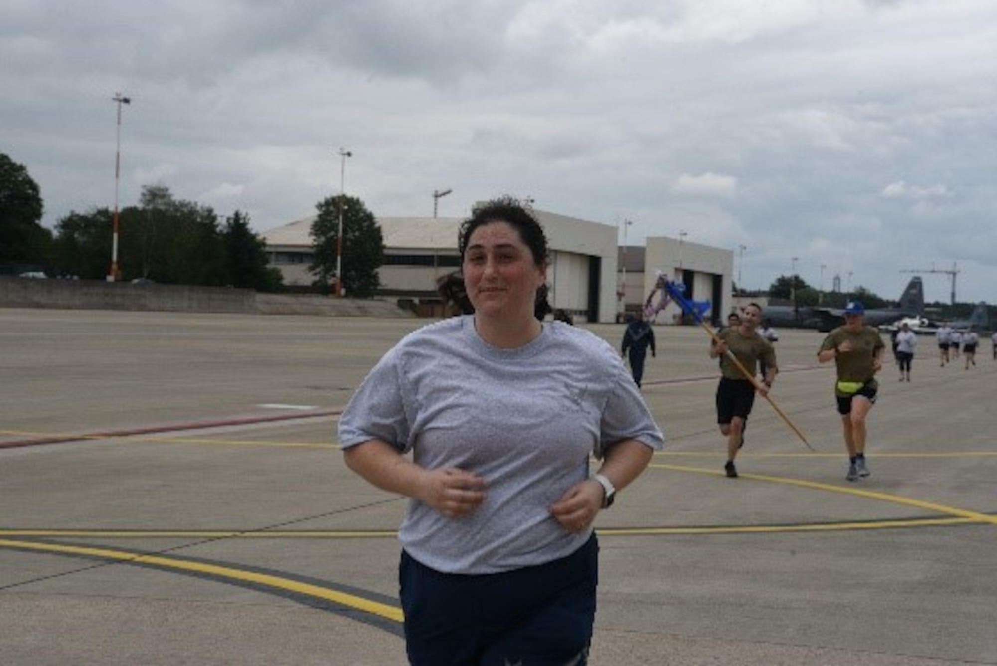 U.S. Air Force Staff Sgt. Molly Jones, 86th Comptroller Squadron budget technician, crosses the finish line at a 5K run at Ramstein Air Base, Germany, July 1, 2021. Members of 86th Airlift Wing squadrons and units from across Ramstein participated in the RUNway 5K run to increase their morale and enjoy one of the first large scale group runs of 2021. (U.S. Air Force photo by Tech. Sgt. Jocelyn Ford)