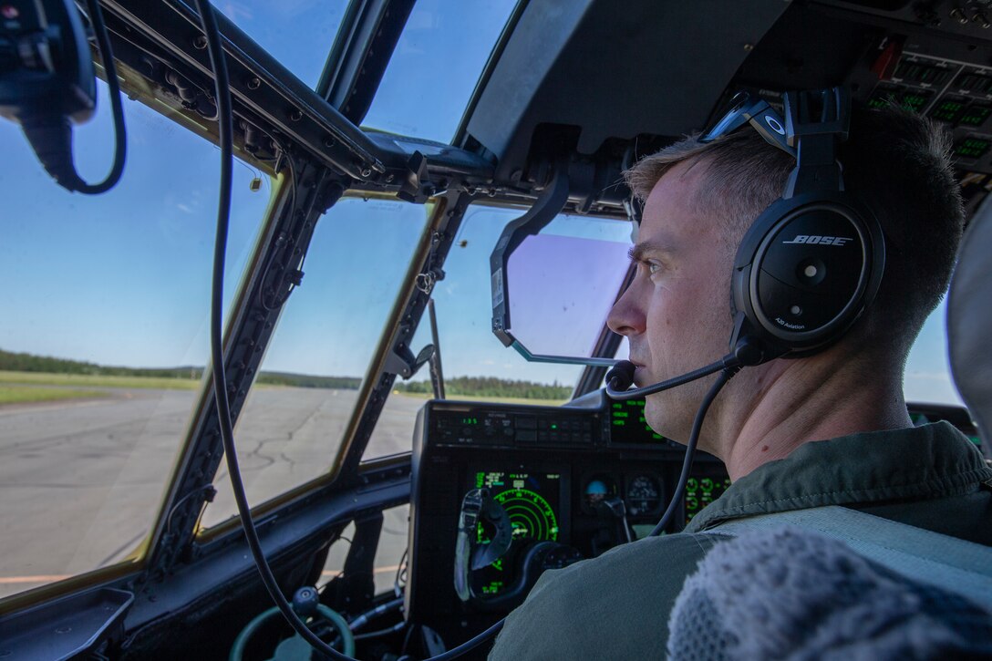 U.S. Marine Corps Capt. Andrew Irwin, a native of Lakeport, California, with Marine Aerial Refueler and Transport Squadron (VMGR) 452, looks out of a KC-130J Super Hercules at Rissala Air Base, near Kuopio, Finland, June 8, 2021. Marines with VMGR-452 are deployed to Kuopio, Finland in support of Squadron Visit ILVES (Finnish for “Lynx”). The purpose of Squadron Visit ILVES is to conduct air-to-air and air-to-ground training, improve proficiency in joint and multinational tactics, and enhance partnerships with international allies. (U.S. Marine Corps photo by Lance Cpl. Caleb Stelter)