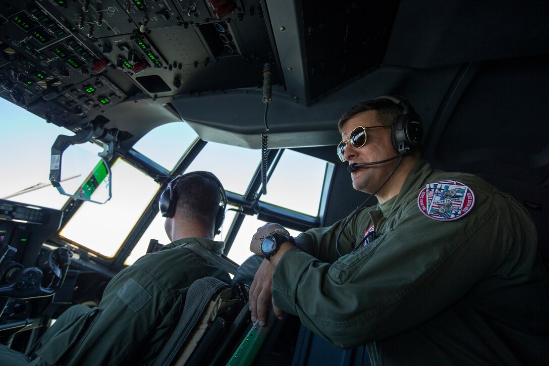 U.S. Marines from Marine Aerial Refueler and Transport Squadron (VMGR) 452 look out of a KC-130J Super Hercules at Rissala Air Base, near Kuopio, Finland, June 8, 2021. Marines with VMGR-452 are deployed to Kuopio, Finland in support of Squadron Visit ILVES (Finnish for “Lynx”). The purpose of Squadron Visit ILVES is to conduct air-to-air and air-to-ground training, improve proficiency in joint and multinational tactics, and enhance partnerships with international allies. (U.S. Marine Corps photo by Lance Cpl. Caleb Stelter)