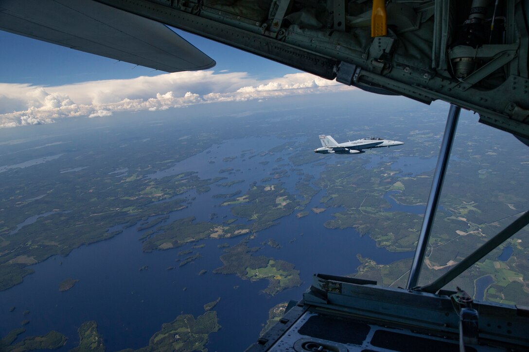 U.S. Marine Corps Maj. Jesse Simmermon, a native of Lancaster, Pennsylvania, maneuvers an F/A-18D Hornet assigned to Marine Fighter Attack Squadron (VMFA) 115 during aerial refueling over Rissala Air Base, near Kuopio, Finland, June 8, 2021. Marines with VMFA-115 are deployed to Kuopio, Finland in support of Squadron Visit ILVES (Finnish for “Lynx”). The purpose of Squadron Visit ILVES is to conduct air-to-air and air-to-ground training, improve proficiency in joint and multinational tactics, and enhance partnerships with international allies. VMFA-115 is a subordinate unit of 2nd Marine Aircraft Wing, the aviation combat element of II Marine Expeditionary Force. (U.S. Marine Corps photo by Lance Cpl. Caleb Stelter)