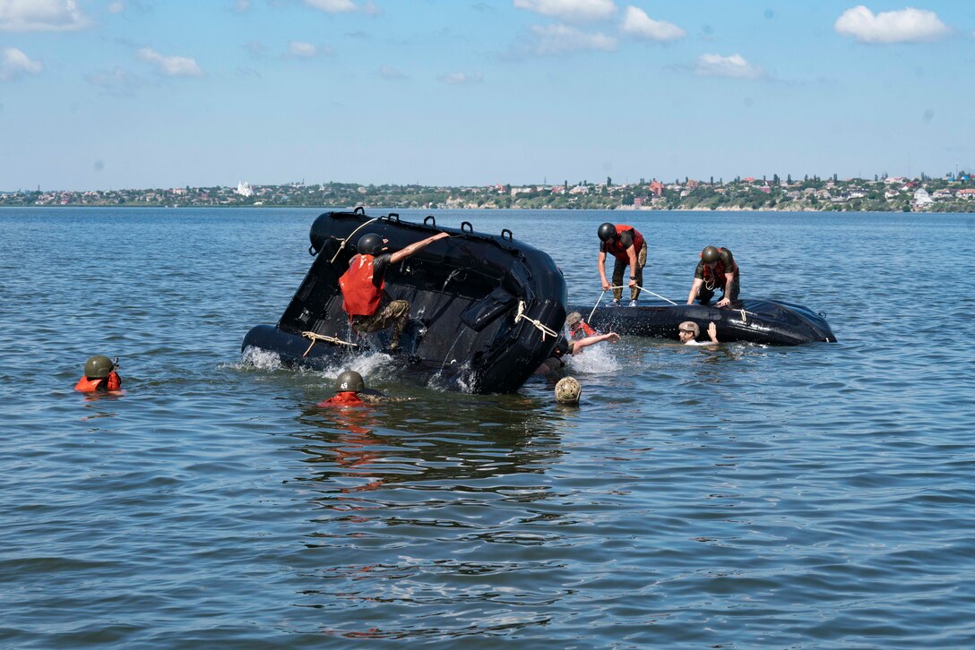 Ukrainian Marines with the 36th Marine Brigade conduct broaching drills during a combat rubber reconnaissance craft (CRRC) practical application class in Mykolayiv, Ukraine, June 9, 2021. During a nine-day period of instruction, U.S. Marines will teach Marines from Ukraine the basics of operating with the CRRC, a small, lightweight, inflatable, yet rugged boat, useful in a variety of missions requiring speed and stealth. (U.S. Marine Corps photo by Cpl. Claudia Nix)