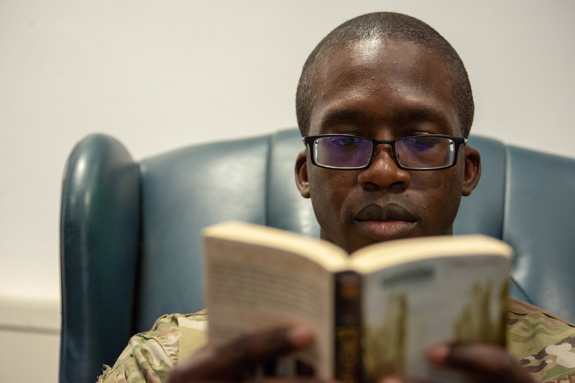 Airman reads book.