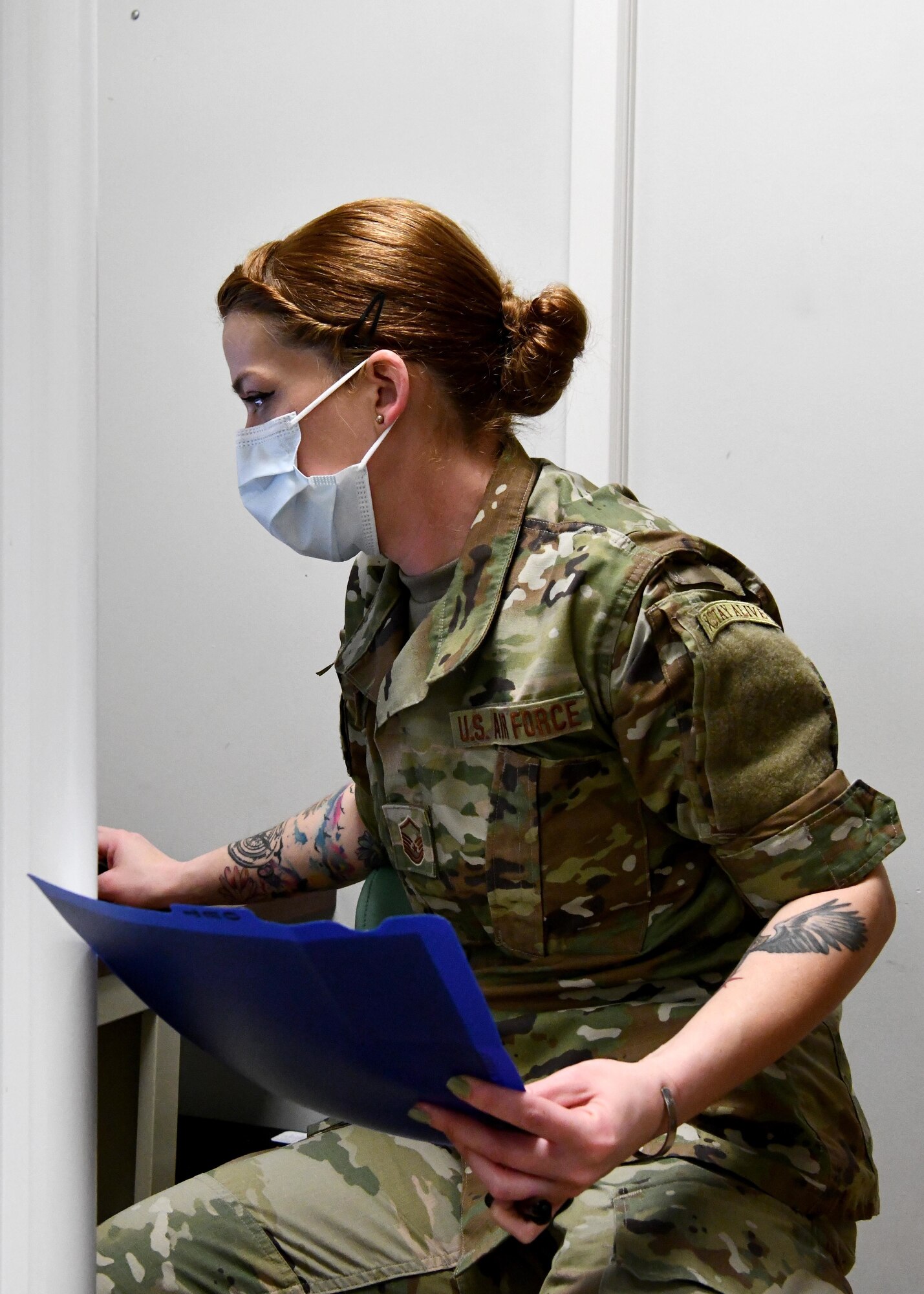 Master Sgt. Erica GriffinKing, 104th dental technician looks over x-ray results for a patient on March 13, 2021 at Barnes Air National Guard Base. Without a dental assessment from her, Barnstormers would be unable to deploy and maintain mission readiness. (U.S. Air National Guard Photo by Airman 1st Class Camille Lienau)