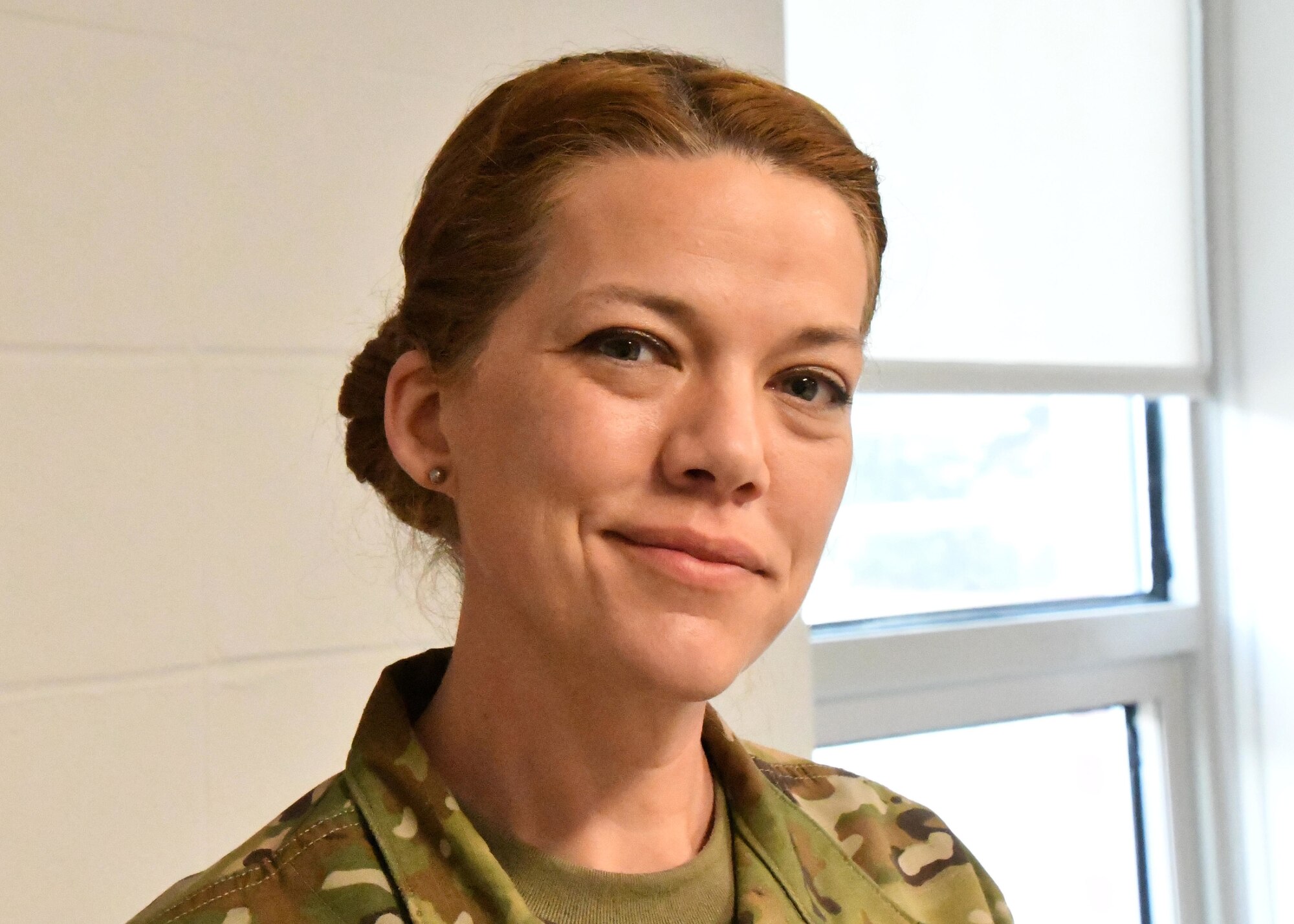 Master Sgt. Erica GriffinKing, 104th dental technician poses for a picture on March 14, 2021 at Barnes Air National Guard Base. As the only dental technician at Barnes, GriffinKing has her work cut out for her. Without a dental assessment from her, Barnstormers would be unable to deploy and maintain mission readiness. (U.S. Air National Guard Photo by Airman 1st Class Camille Lienau)