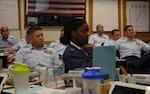 Air Force Master Sgt. Kelisha Brown and fellow Coast Guard senior enlisted leaders listen to leadership best practices as part of the Coast Guard Chief Petty Officers’ Academy at Coast Guard Training Center Petaluma, Sept. 4, 2014. The monthlong course, which is open to a select few senior enlisted leaders from other military services, helps prepare new Coast Guard chiefs for the increased responsibility they take on as members of the Chief Petty Officer Corps. Instruction is provided in work-life, wellness, human resource management, oral and written communications, career management, human relations and military customs and courtesies.