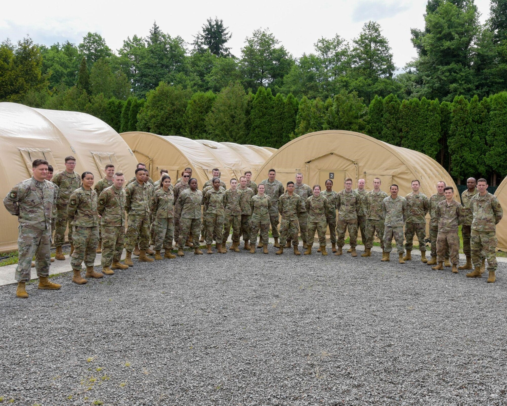 U.S. Air Force Airmen from the 700th Contracting Squadron, 764th Enterprise Sourcing Squadron and 52nd CONS pose for a group photo on Ramstein Air Base, Germany, June 28, 2021. These Airmen participated in a contracting training event simulating a deployed environment, which serves as an annual requirement for their career field. (U.S. Air Force photo by Airman 1st Class Madelyn Keech)