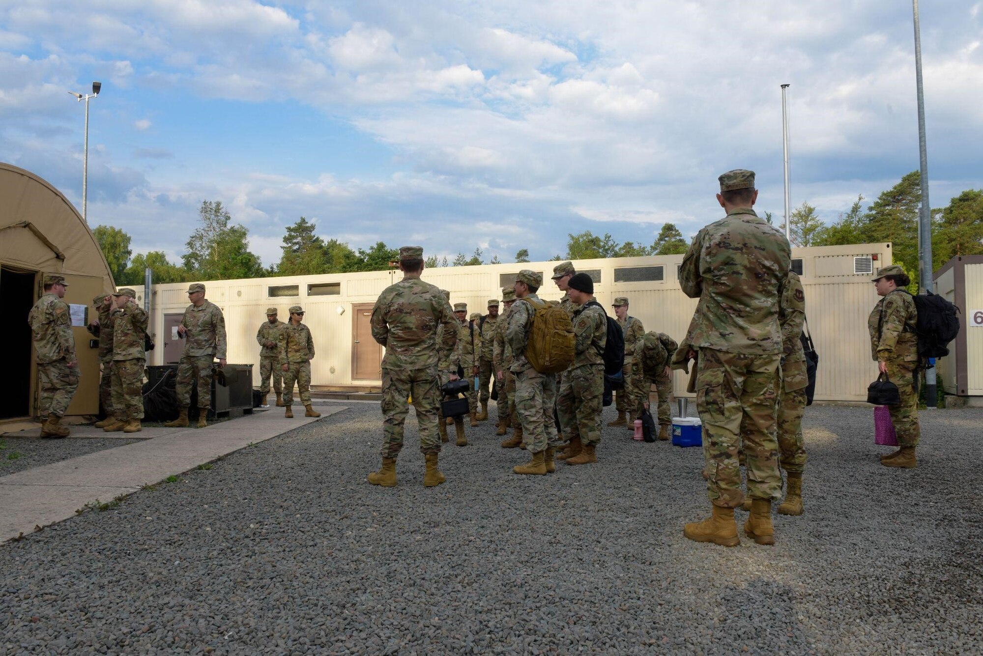 U.S. Air Force Airmen from the 700th Contracting Squadron, 764th Enterprise Sourcing Squadron and 52nd CONS wait for a contracting training exercise to begin on Ramstein Air Base, Germany, June 28, 2021. The exercise takes place annually to give Airmen an opportunity to train in a simulated deployed environment. (U.S. Air Force photo by Airman 1st Class Madelyn Keech)
