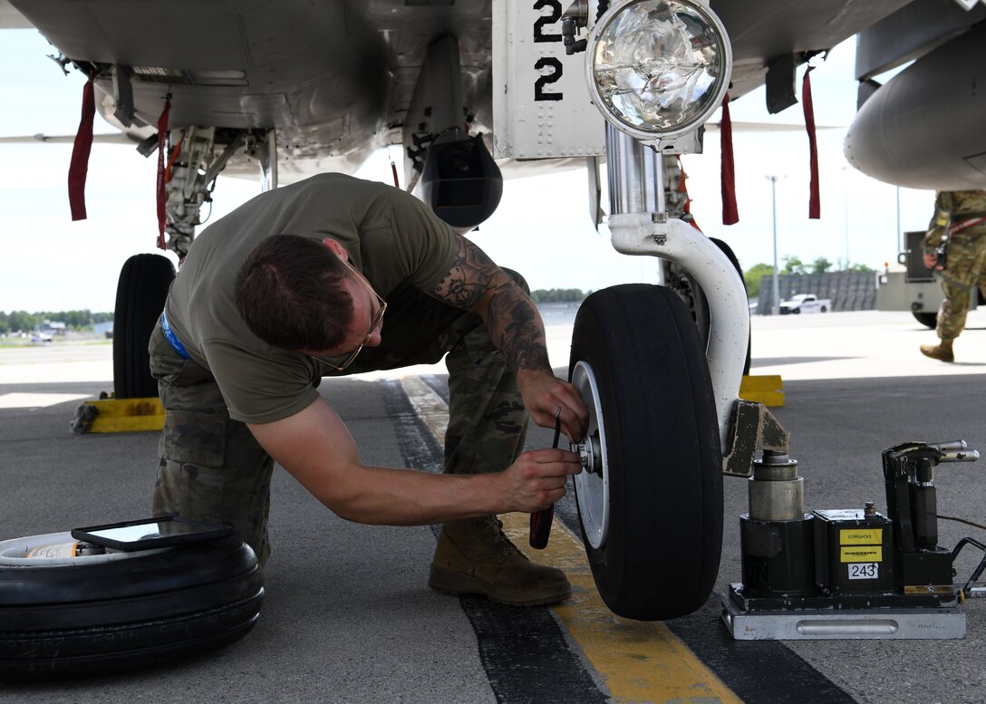 The 104th Fighter Wing held a four day Readiness Exercise June 10 - 13 at Barnes Air National Guard Base.  The REX allows all elements of the 104FW to hone their skills in support of both the State and Federal mission, ensuring the highest degree of readiness to respond to a mission at a moments notice.   The 104 Maintenance Group Airmen changed out a simulated flat tire on an F-15C after it landed.  (U.S Air National Guard Photos by Master Sgt. Lindsey S. Watson)
