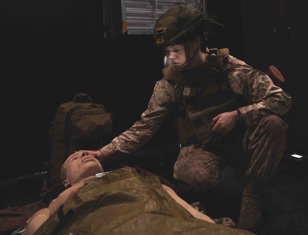 U.S. Navy Petty Officer 3rd Class Abigail Clark, a Clarksville, Md., native and a hospital corpsman with 1st Battalion, 2d Marine Regiment (1/2), 2d Marine Division (MARDIV), administers continuous care over a five hour period to a simulated casualty as part of 2d MARDIV’s prolonged casualty care course on Camp Lejeune, N.C., July 2, 2021. The course prepared the sailors to provide efficient care over an extended period of time while under adverse conditions. (U.S. Marine Corps photo by Lance Cpl. Emma L. Gray)