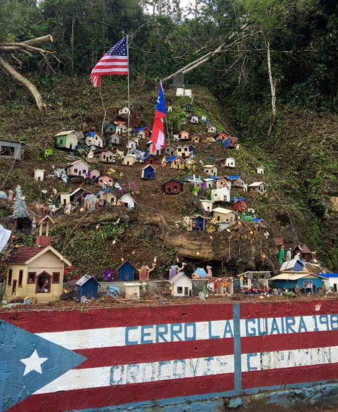 In the aftermath of Hurricane Maria, a Puerto Rico community celebrated Christmas by using birdhouses to build a nativity scene. Several of the birdhouses’ roofs are painted blue to symbolize the corps’ Blue Roof mission. Operation Blue Roof provides homeowners in disaster areas with temporary roofing, made of fiber-reinforced sheeting, that protects damaged roofs until permanent repairs can be made (U.S. Army photo by James Frost).