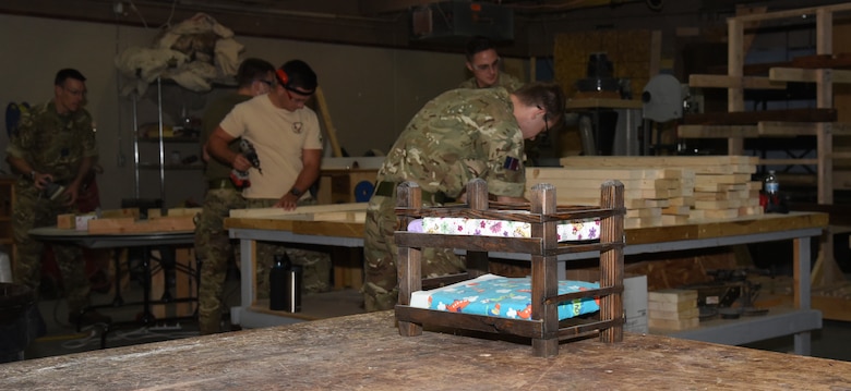 United Kingdom Royal Air Force prepare pieces of wood