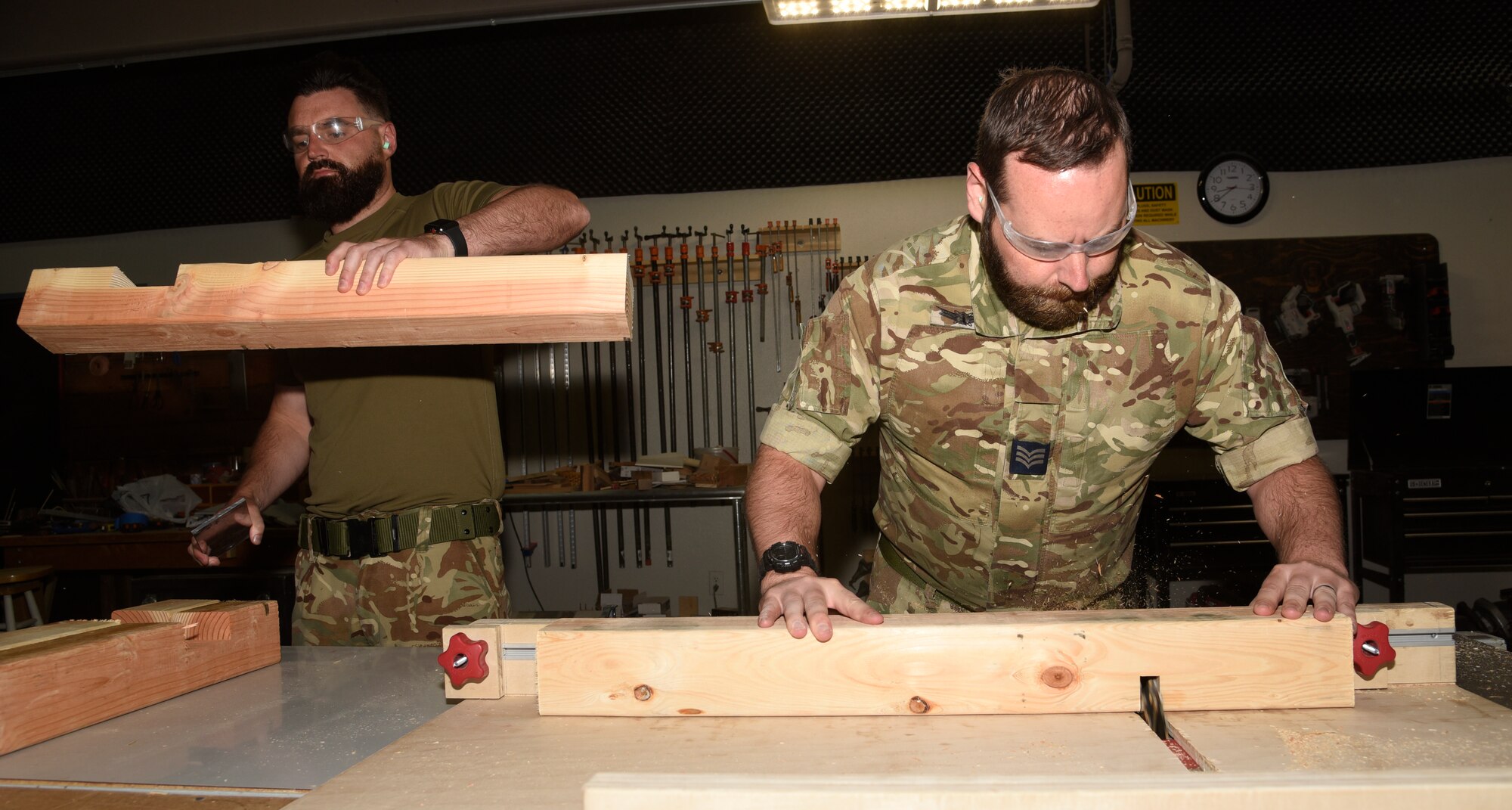 United Kingdom Royal Air Force prepare pieces of wood