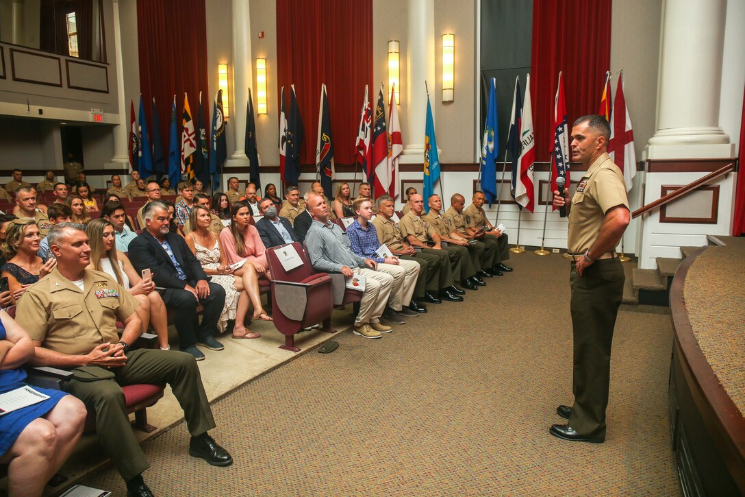 U.S. Marine Corps Col. Edward J. Danielson, outgoing commanding officer for Headquarters Battalion, Training and Education Command, speaks during the Headquarters Battalion, Training and Education Command change of command ceremony at Breckinridge Hall on Marine Corps Base Quantico, Virginia, June 25, 2021. A change of command signifies a formal transfer of authority and responsibility for a unit from one commander to another. (U.S. Marine Corps Photo by Lance Cpl. Mitchell Johnson)