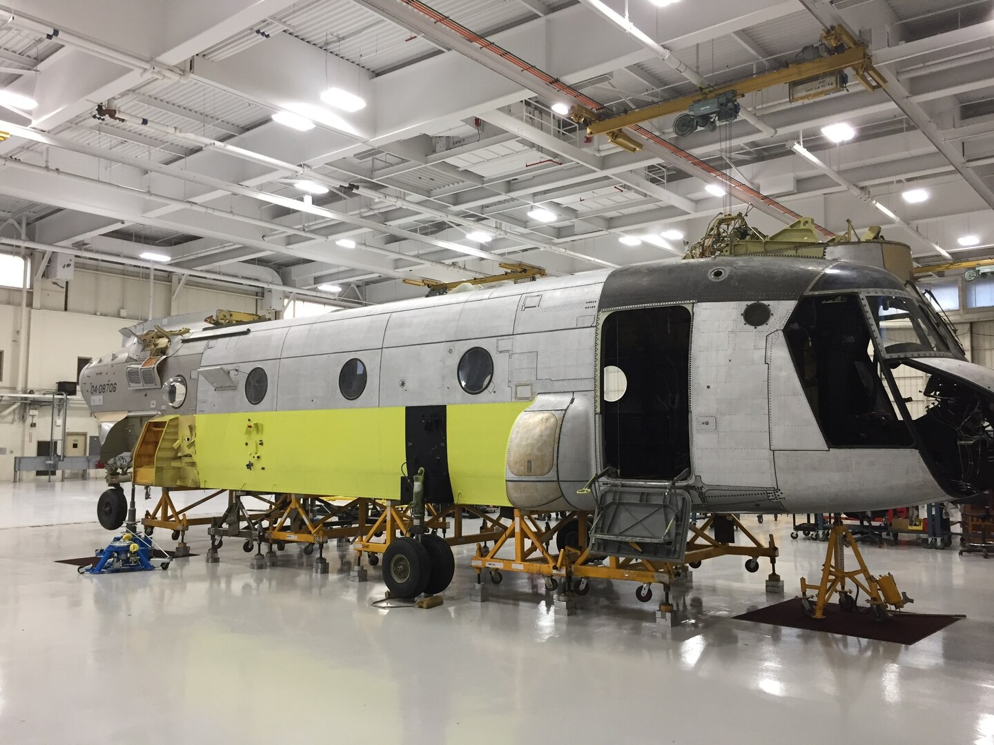 The shell of a CH-47 Chinook helicopter that was battle-damaged from a hard landing while serving in Iraq sits in the maintenance bay of the Connecticut National Guard's 1109th Theater Aviation Support Maintenance Group in Groton, Conn., Sept. 3, 2019. The restoration of the aircraft was part of an initiative by the unit to restore inoperable aircraft and get them back in the Army's operational fleet.