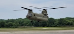 A Ch-47 Chinook helicopter hovers for the first time in two years at the Connecticut National Guard's 1109th Theater Aviation Support Maintenance Group in Groton, Conn., June 2, 2021. The helicopter was damaged after a hard landing while serving in Iraq and had been sitting in Kuwait since 2018 awaiting repairs.