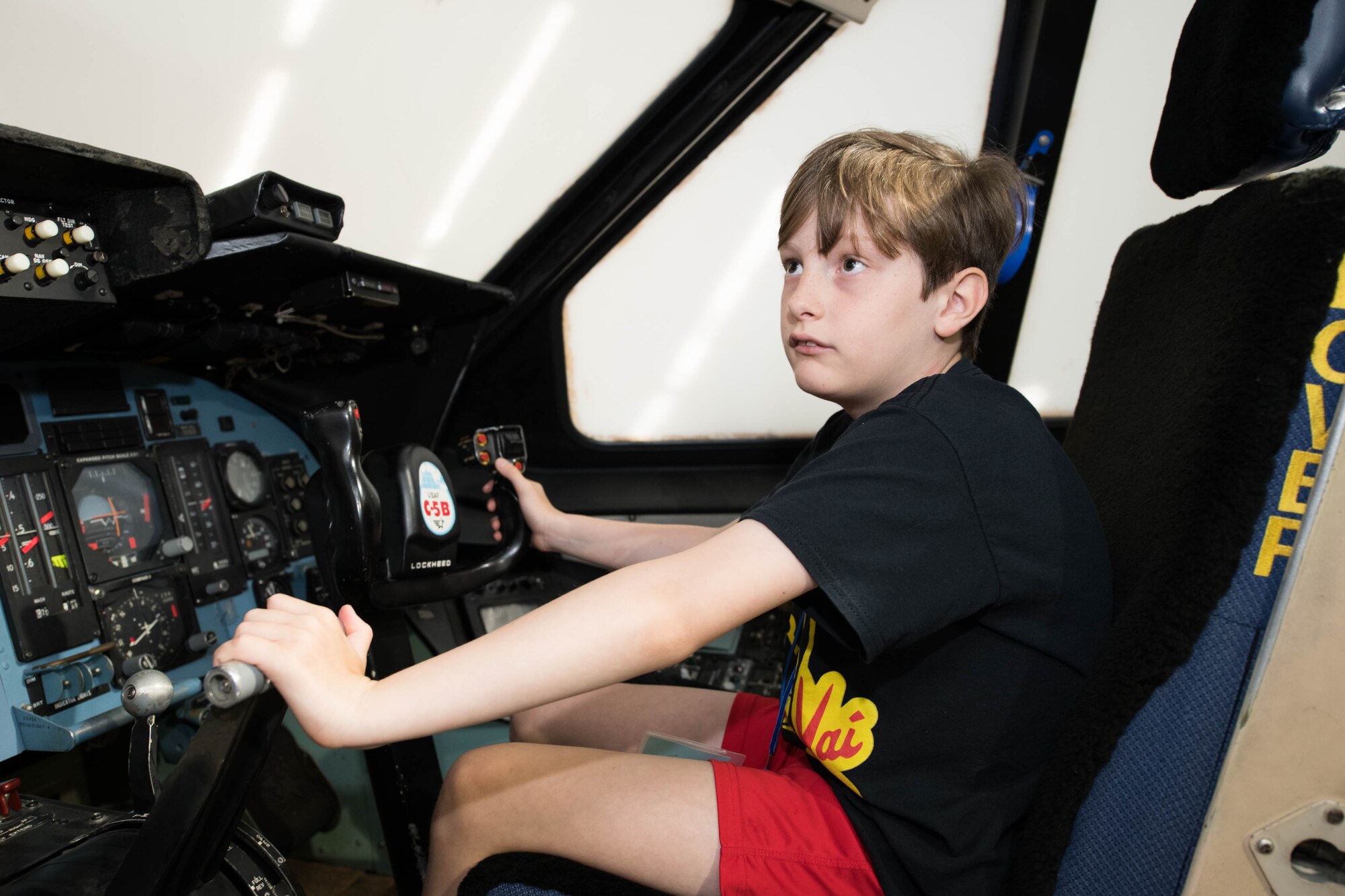 Henry Griffin practices cockpit procedures on a C-5B trainer during a 2021 Aviation Summer Camp at the Air Mobility Command Museum in Dover, Delaware, July 1, 2021. This is the first summer camp the AMC museum has hosted since the COVID-19 pandemic. (U.S. Air Force photo by Mauricio Campino)