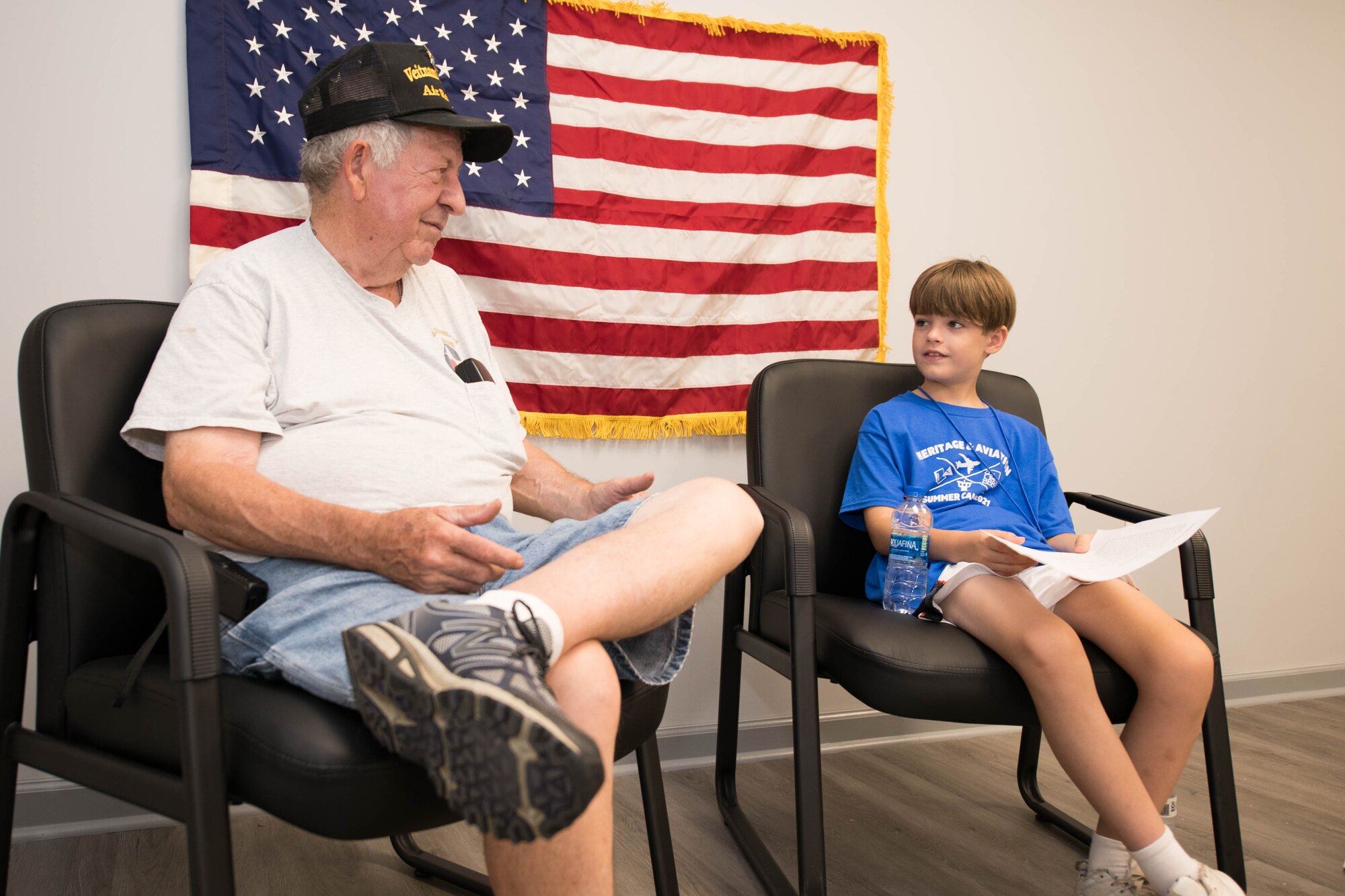 Rhys Cramer interviews Don Hall, Air Mobility Command Museum volunteer and Air Force veteran, during a 2021 Aviation Summer Camp at the AMC Museum in Dover, Delaware, July 1, 2021. During the interview, Hall, a Vietnam War veteran, discussed his military experiences. (U.S. Air Force photo by Mauricio Campino)