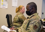 U.S. Air Force Tech. Sgt. Brenda Franklin, left, a public health specialist with the 116th Medical Group, conducts a medical examination with Tech. Sgt. Dewayne Bembry, an aerospace propulsion craftsman with the 116 Maintenance Squadron, after he returned from a COVID-19 vaccination mission, Robins Air Force Base, Georgia, July 1, 2021. Airmen and Soldiers from the Georgia National Guard vaccinated more than 170,000 people.