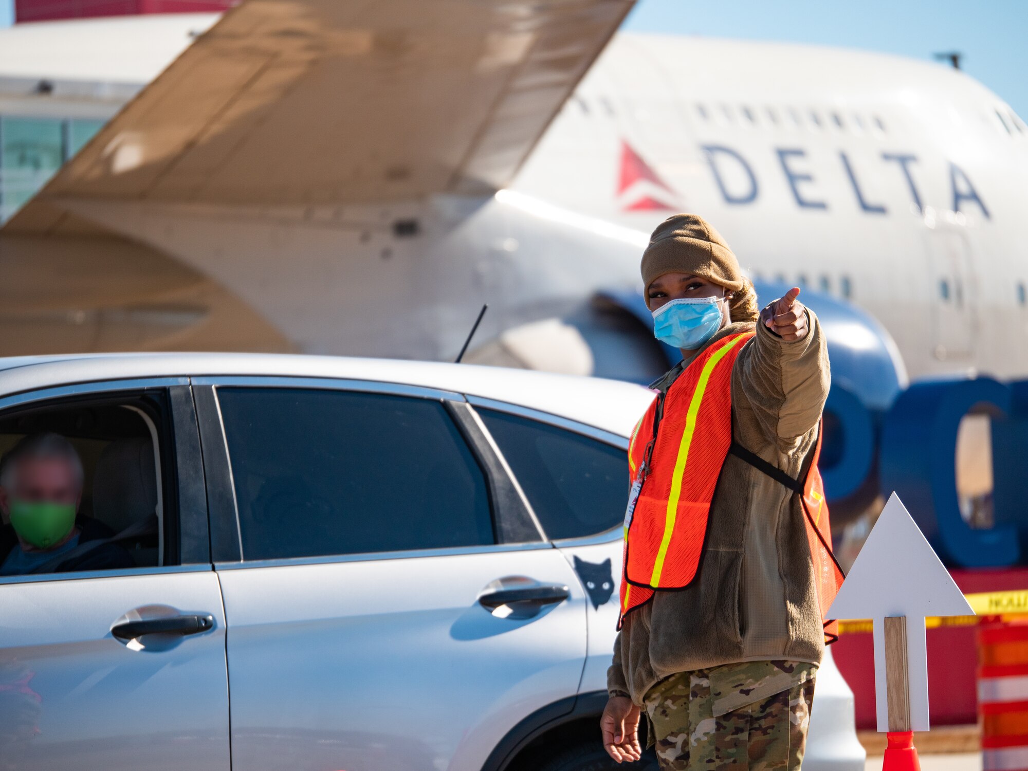 Georgia Air National Guard member directs traffic at COVID-19 vaccination site