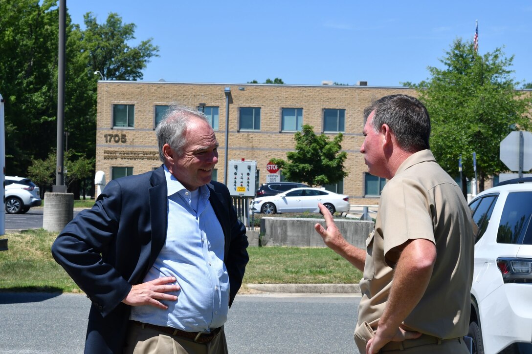IMAGE; DAHLGREN, Va. – U.S. Sen. Tim Kaine and Naval Surface Warfare Center Dahlgren Division (NSWCDD) Commanding Officer Capt. Stephen “Casey” Plew converse following a tour of NSWCDD’s Submarine-Launched Ballistic Missile facility. The tour was one stop during Kaine’s visit to NSWCDD on June 30.