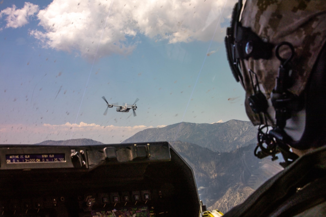 A U.S. Marine Corps MV-22B Osprey pilot with Marine Medium Tiltrotor Squadron (VMM) 166, Marine Aircraft Group 16, 3rd Marine Aircraft Wing, flies in formation during the final flight of the squadron in California, June 30, 2021. VMM-166 conducted its final flight in preparation for deactivation in accordance with Force Design 2030, which is a plan that will ensure the Marine Corps is prepared to stand as the nation’s naval expeditionary force-in-readiness. (U.S. Marine Corps photo by Lance Cpl. Quince Bisard)