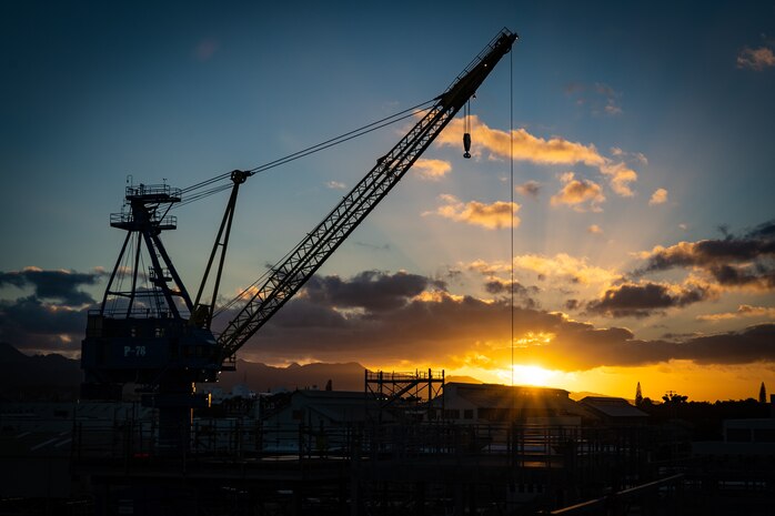 Pearl Harbor, Hawaii - Pearl Harbor Naval Shipyard & IMF, (February 11, 2021) Sunrise over the Ko`olau Mountains with portal crane P-76 in the foreground.