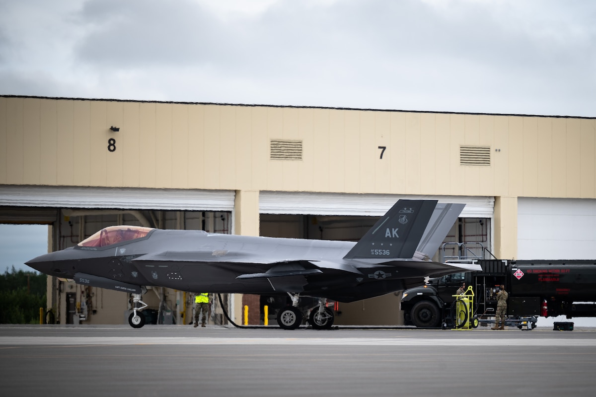 U.S. Airmen assigned to the 354th Fighter Wing perform a hot pit refueling on an F-35A Lightning II aircraft assigned to the 355th Fighter Squadron on Eielson Air Force Base, Alaska, July 7, 2021.