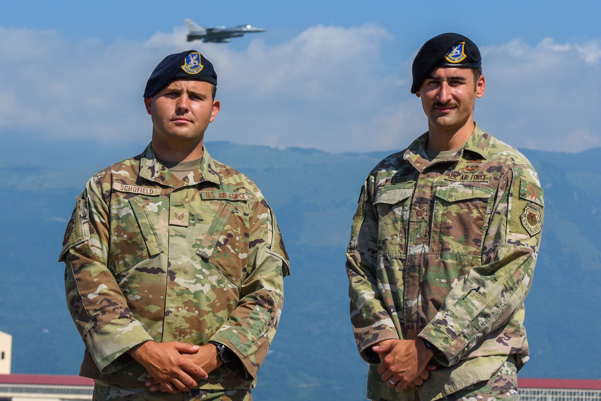 U.S. Air Force Staff Sgt. Levi Schofield, 31st Security Forces Squadron fire team leader, left, and Tech. Sgt.. Jordan Whitlock, 31st SFS squad leader, pose for a photo on the flight line at Aviano Air Base, Italy, July 7, 2021. Whitlock, Schofield and U.S. Air Force Master Sgt. Mario Vaiese, 31st SFS team leader, responded to a head-on collision involving a van and four Moroccan nationals on two mopeds during a temporary duty travel (TDY) in Ben Guerir, Morocco, for exercise AFRICAN LION, June 11, 2021. (U.S. Air Force photo by Airman 1st Class Brooke Moeder)