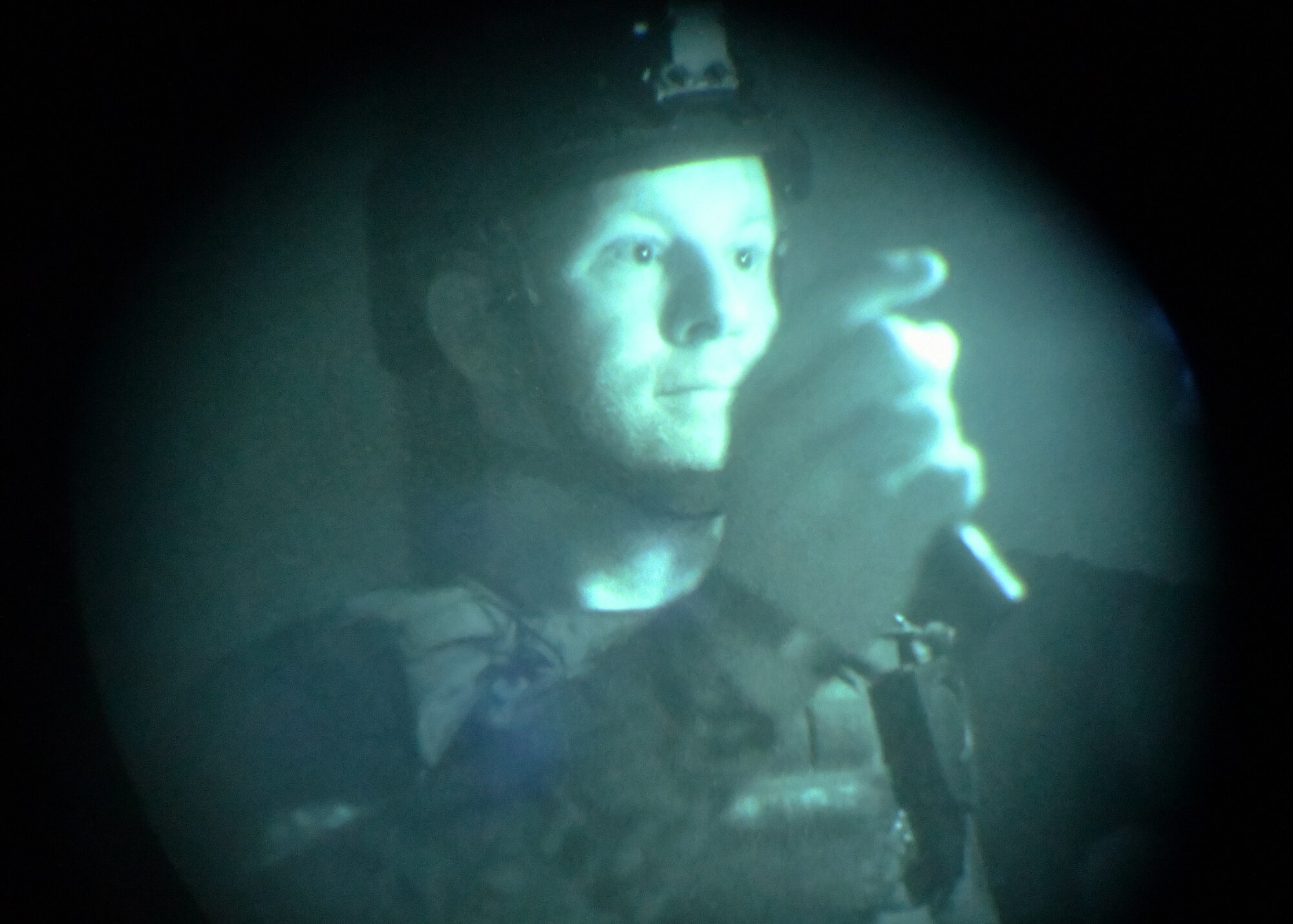 Adam Cavanaugh, New Jersey state police department bomb squad detective, advances through a no light/low light training scenario during Raven's Challenge Interoperability Exercise June 9, 2021, at Fort Devens Army Base, Devens, Massachusetts. The NJPD and Airmen from the 104th Fighter Wing spent a week at the exercise training together in various scenarios, promoting interoperability between the agencies in operational environments while promoting teamwork and innovation.  (U.S. Air National Guard photo by Senior Airman Sara Kolinski)