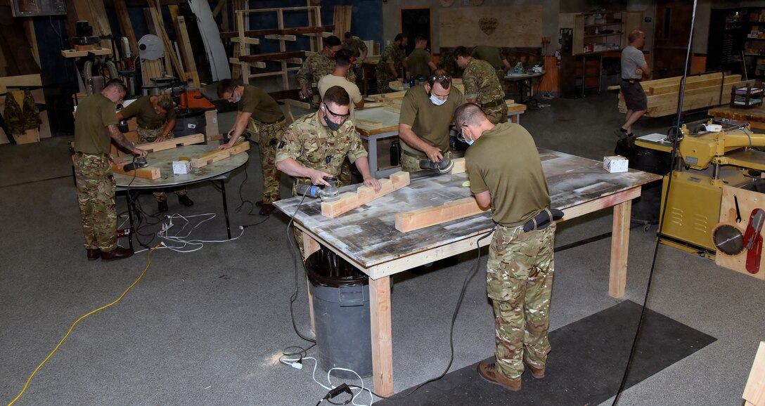 United Kingdom Royal Air Force prepare pieces of wood
