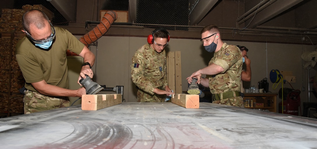 United Kingdom Royal Air Force prepare pieces of wood