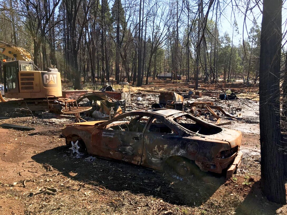 A scorched car frame that survived the Camp Fire in Paradise, California. The frame, among other debris, was cleared before disaster response crews could begin rebuilding the housing lots (U.S. Army Photo by James Frost).