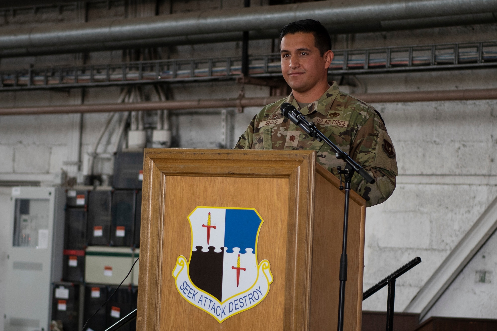 U.S. Air Force Maj. Bryan Beals, 52nd Aircraft Maintenance Squadron commander, gives his first remarks during his assumption of command ceremony, July 6, 2021, on Spangdahlem Air Base, Germany. Beals comes from Headquarters Pacific Air Forces, Joint Base Pearl Harbor-Hickam, Hawaii, where he was the chief of logistics plans branch in the logistics, engineering and force protection directorate. (U.S. Air Force photo by Staff Sgt. Melody W. Howley)