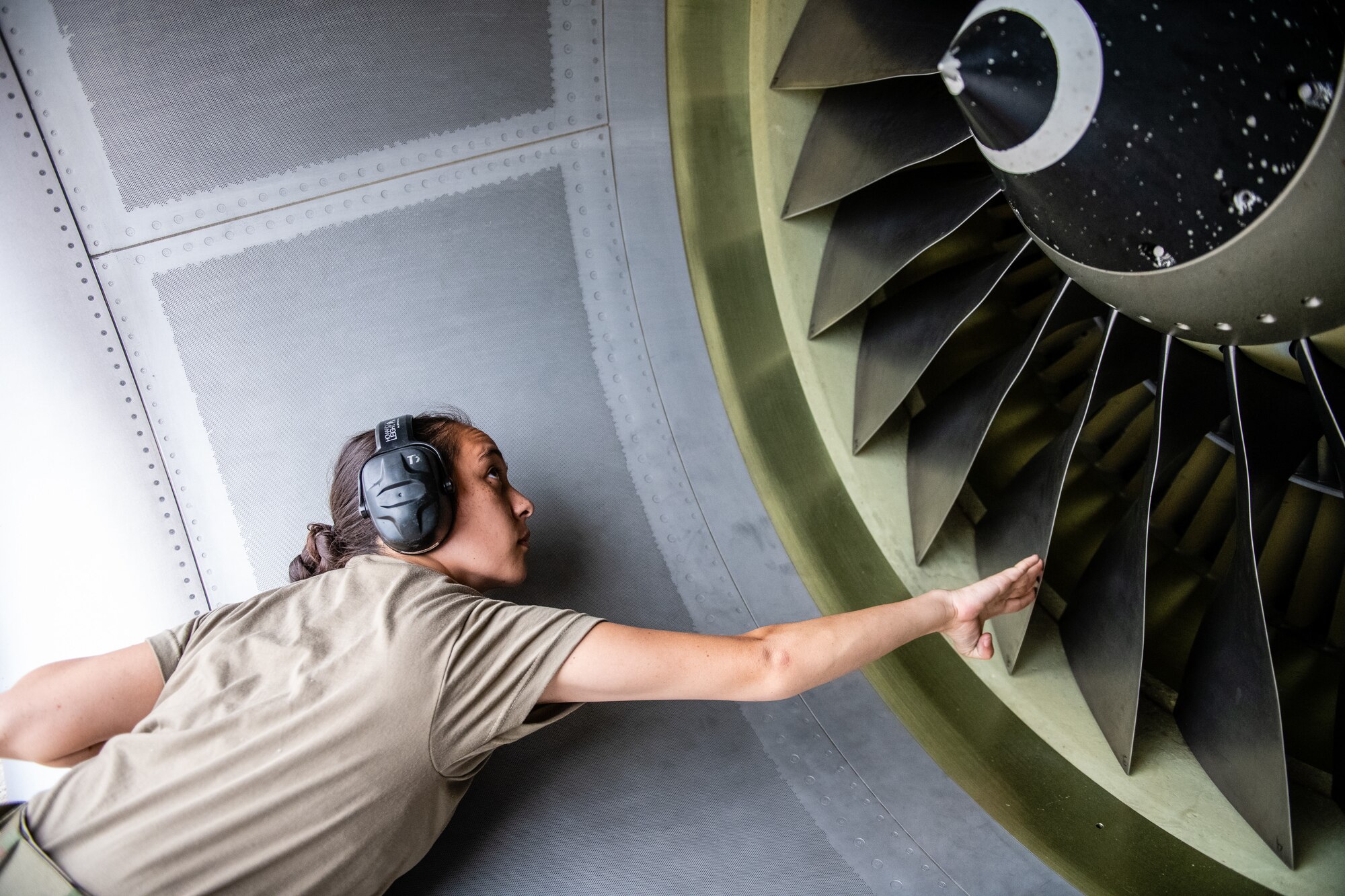 Senior Airman Janice Williams, 932nd Maintenance Squadron crew chief, performs a pre-flight inspection and launches the aircraft June 30, 2021, Scott Air Force Base, Illinois. (U.S. Air Force photo by Christopher Parr)