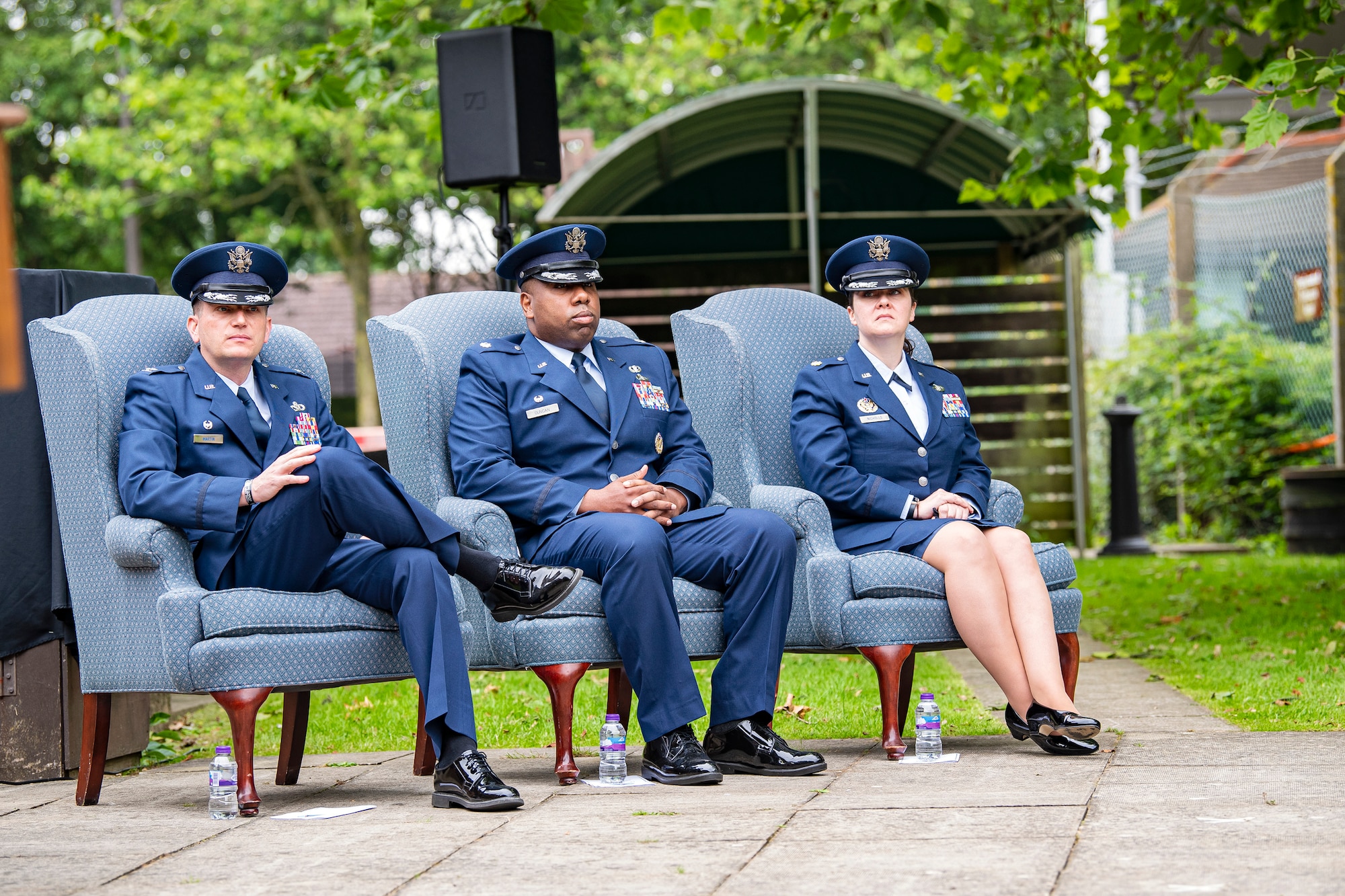 U.S. Air Force Col. Richard Martin, left, 423rd Air Base Group commander, Lt. Col. Jarvora Duncan, center, 423rd Force Support Squadron outgoing commander, and Maj. Kirsten Nicholls, 423rd Force Support Squadron incoming commander, sit as the official party during a change of command ceremony at RAF Alconbury, England, July 8, 2021. During the ceremony Duncan relinquished command of the 423rd FSS to Nicholls. (U.S. Air Force photo by Senior Airman Eugene Oliver)