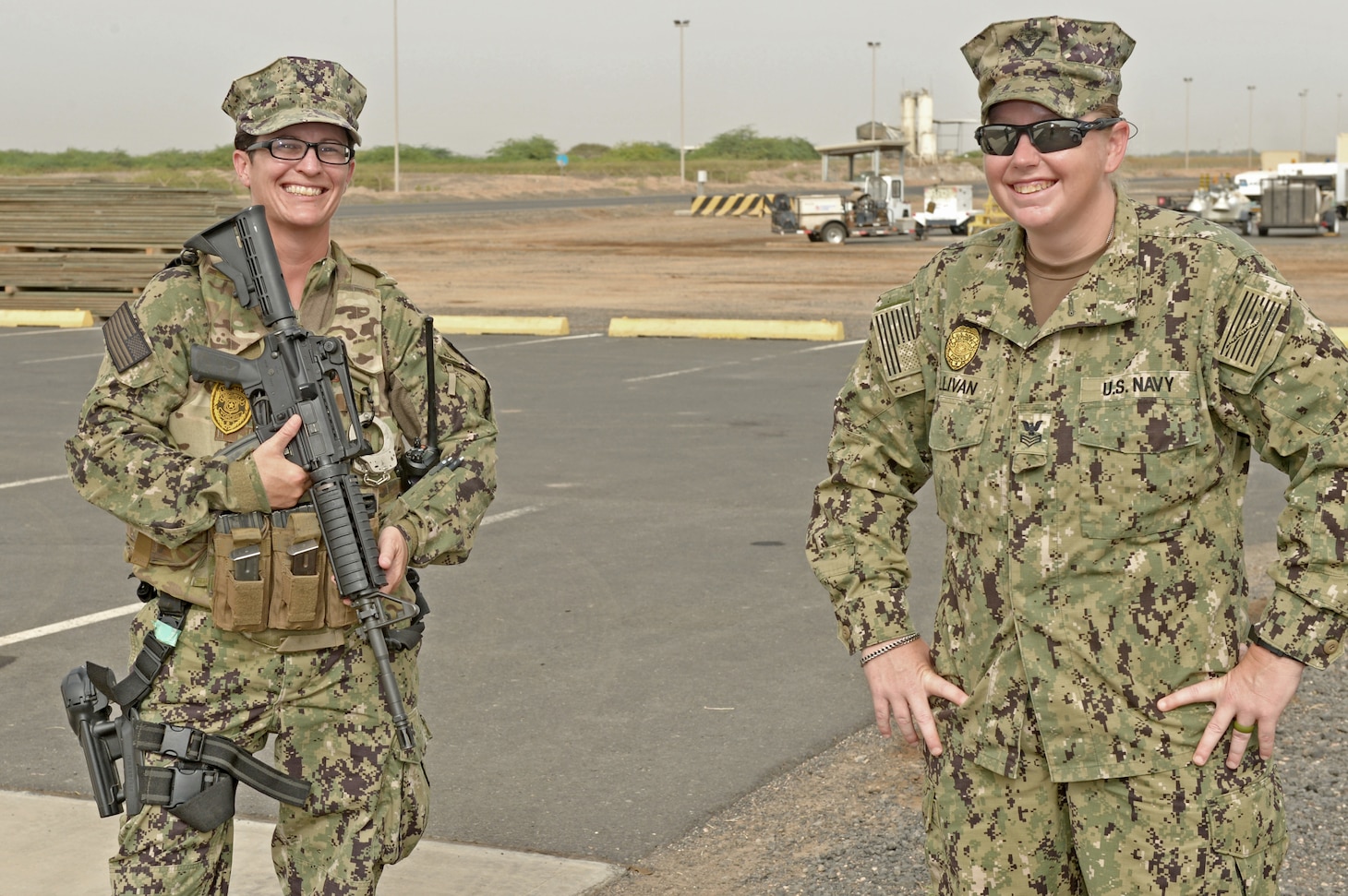 CAMP LEMONNIER, Djibouti (June 15, 2021) U.S. Navy Master-at-Arms 1st Class Caitlin Sullivan, right, from Louisville, Ky., and Master-At Arms First Class Sheana McAnerny, from Strawberry, Ariz., both attached to Camp Lemonnier’s Security Department, stand together on Camp Lemonnier’s flight line. Camp Lemonnier is strategically located in Djibouti, close to the Bab al-Mandab Strait, at the south end of the Red Sea. Camp Lemonnier helps U.S., allied and partner nation forces maintain security in Europe, Africa and Southwest Asia. (U.S. Navy photo by Mass Communication Specialist 1st Class Jacob Sippel)