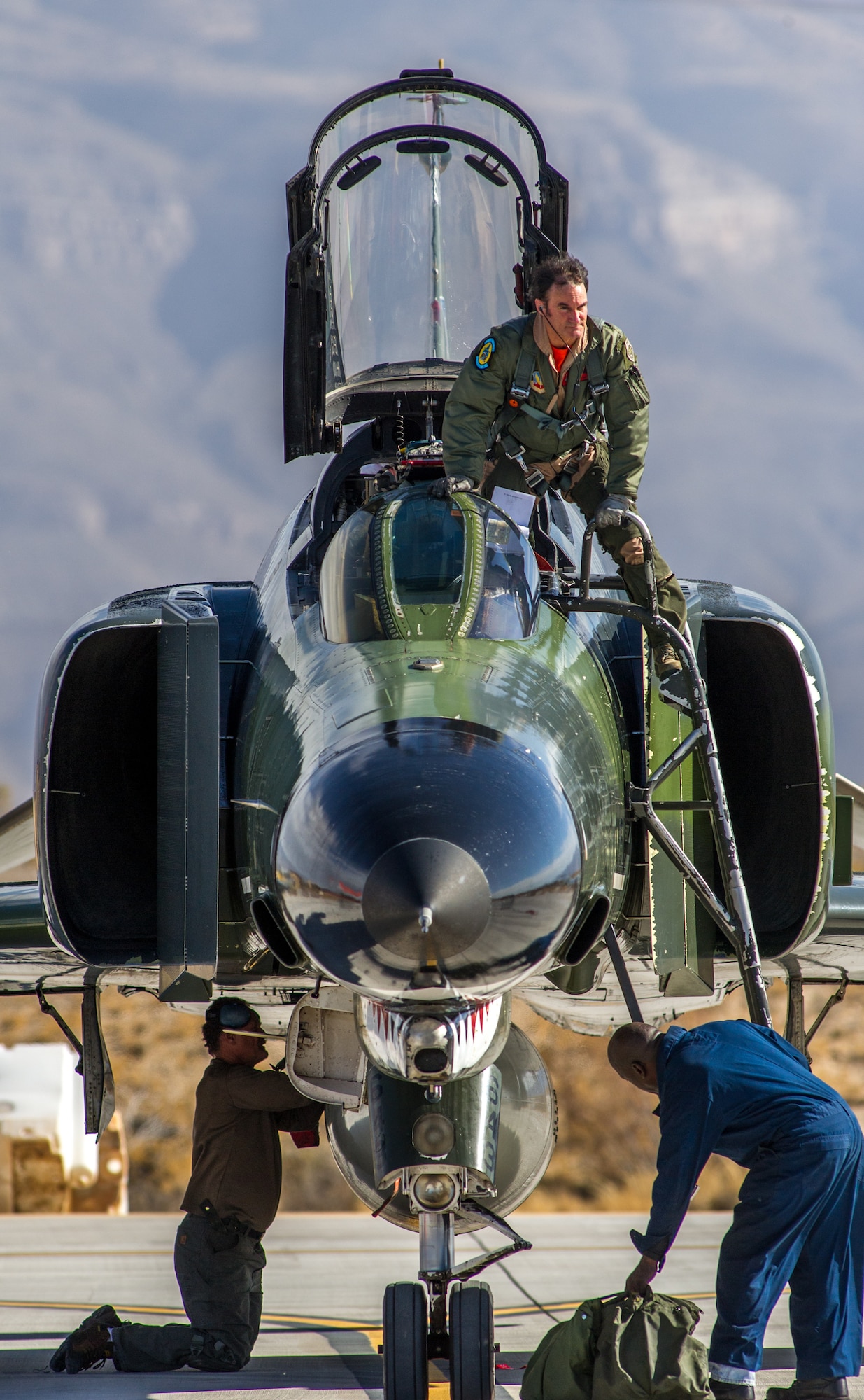 Civilian QF-4E Pilot/Controller Lt. Col. (Ret) Jim "WAM" Harkins, exits his McDonnell Douglas F-4 Phantom II, after a rehearsal for the final military flight and retirement ceremony for the storied aircraft at Holloman AFB, N.M., Dec. 16, 2016. The final variant of the Phantom II was the QF-4 unmanned aerial targets flown by the 82nd Aerial Target Squadron Detachment 1 at Holloman AFB. The ceremonial flight was Harkins last in a cockpit for DoD; he will now be a ground controller for the QF-4's replacement, the QF-16. The F-4 Phantom II entered the U.S. Air Force inventory in 1963 and was the primary multi-role aircraft in the USAF throughout the 1960s and 1970s. The F-4 flew bombing, combat air patrol, fighter escort, reconnaissance and the famous Wild Weasel anti-aircraft missile suppression missions.  (U.S. Air Force photo by J.M. Eddins Jr.)