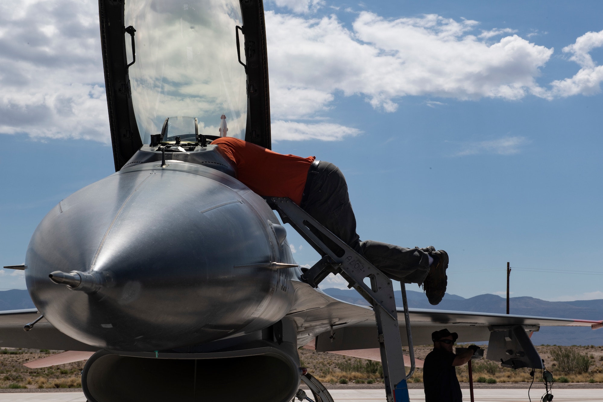 Civilian Maintainers prepare QF-16s for a dress rehearsal flight at Holloman Air Force Base, New Mexico before the planned shoot down of a QF-16 over the White Sands Missile test range. (U.S. Air Force photo by Tech. Sgt. Perry Aston)